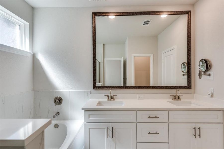 Full bath with double vanity and a bath Full bath with double vanity and a bath