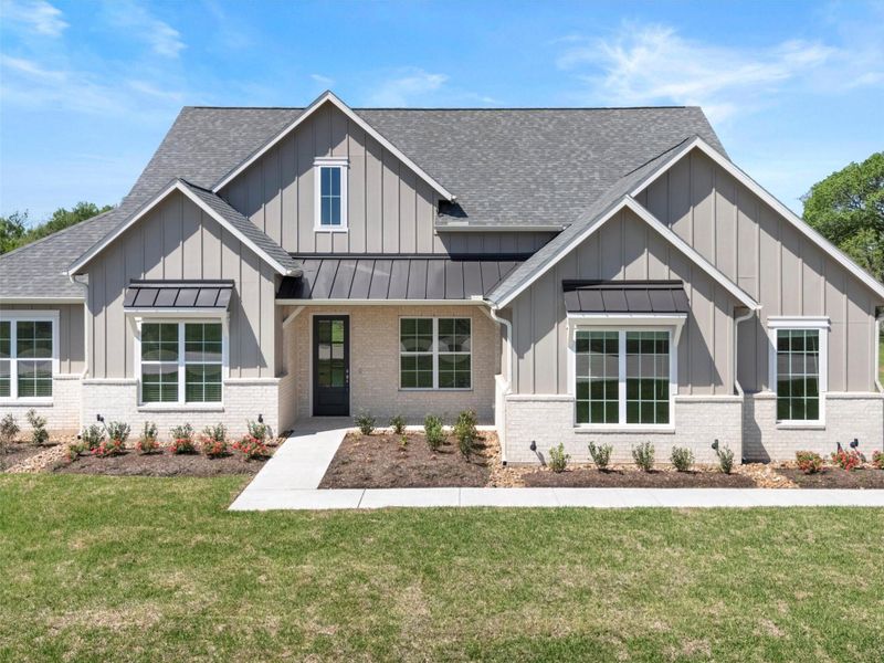 Front exterior of a new home in , Smithville, TX, highlighting curb appeal (Image 2). Front exterior of a new home in , Smithville, TX, highlighting curb appeal (Image 2).