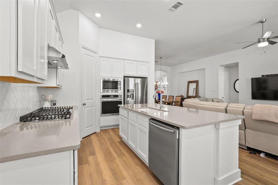 Kitchen is open to the living and dining areas Kitchen is open to the living and dining areas