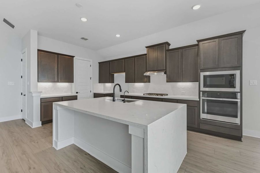Representative furnished interior of a home built from the Brandon by Chesmar Homes in The Reserve at Potranco Oaks, Castroville (Image 7).