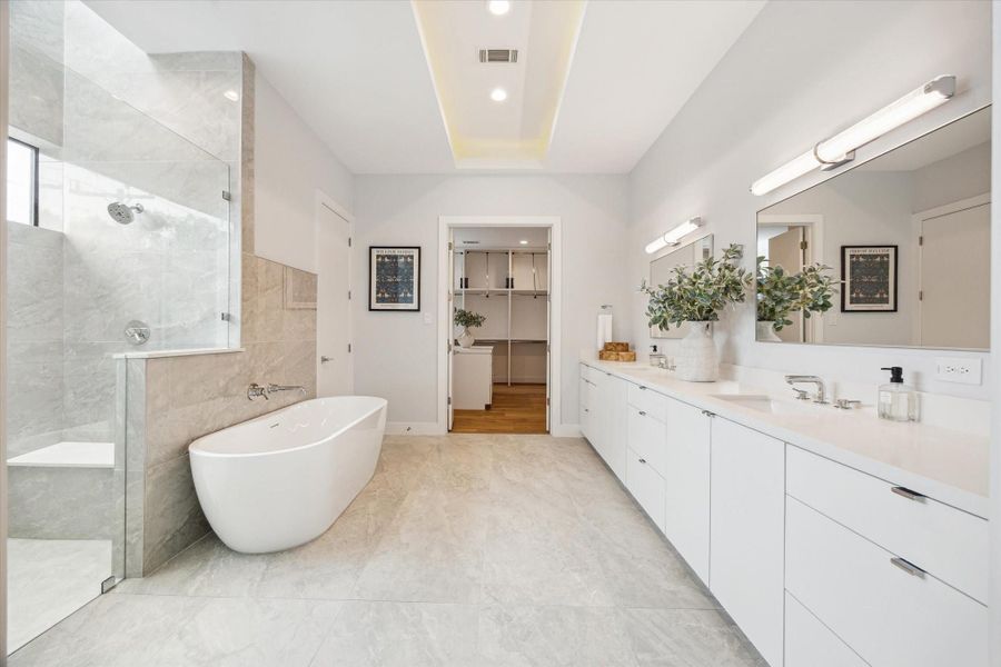 Light-filled primary bath including a skylight in the shower