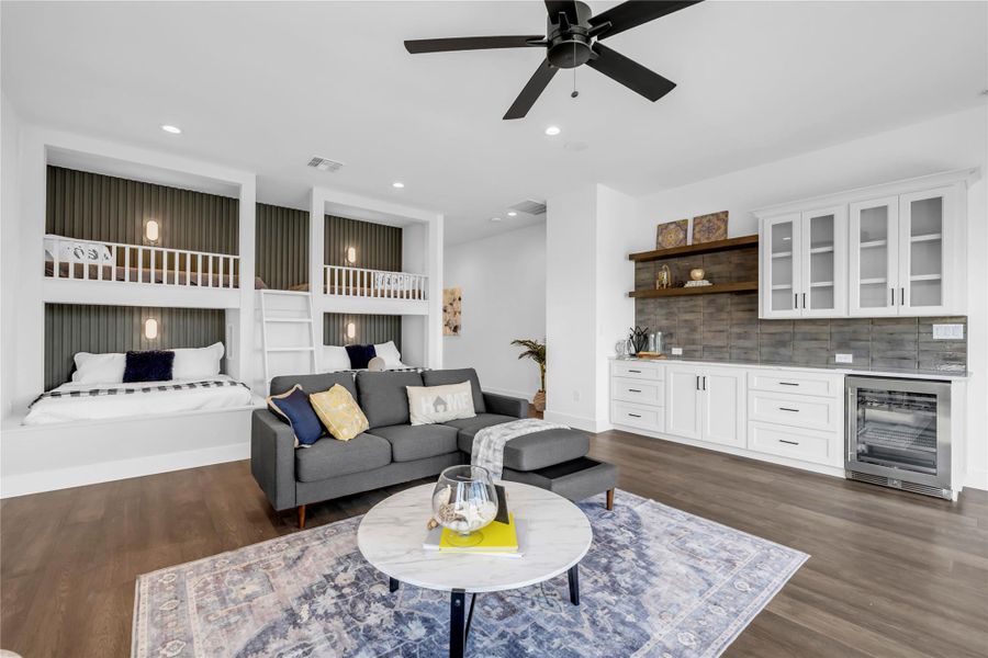 Living area with beverage cooler, recessed lighting, dark wood-style floors, a bar, and ceiling fan