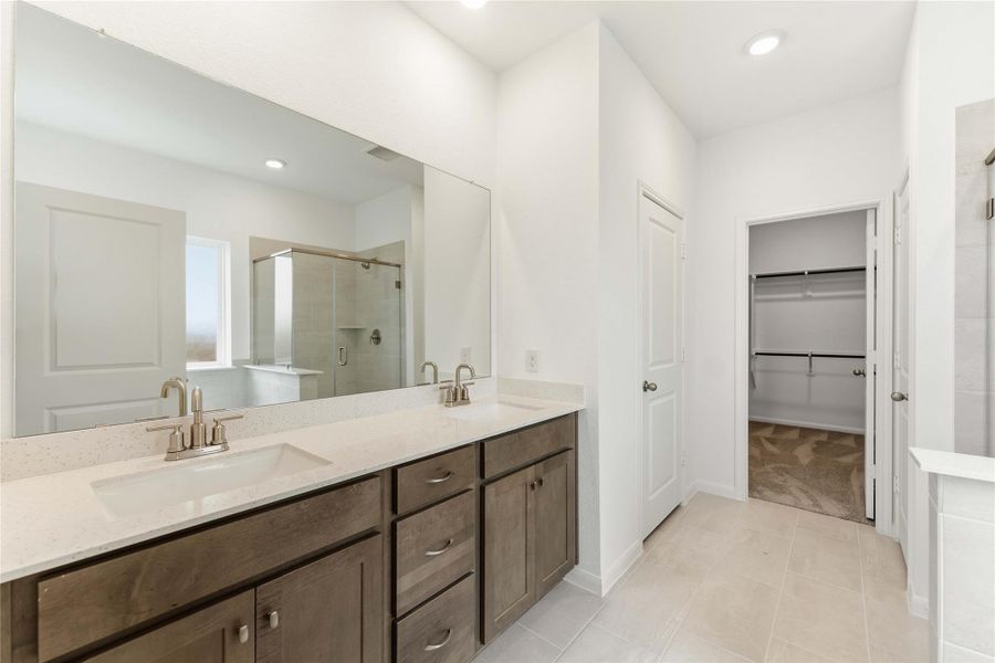 Furnished interior view inside a new home in Sunterra, Katy (Image 12).