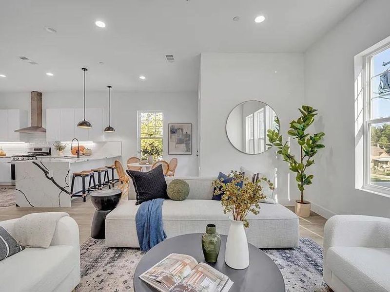 Living area featuring recessed lighting and baseboards