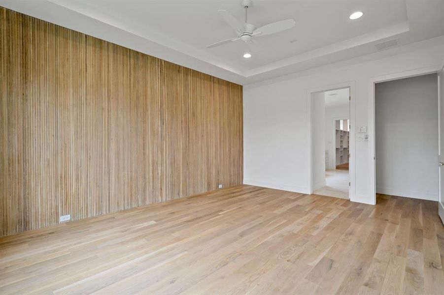 The first floor master bedroom suite is just off of the main living area though a private hallway.