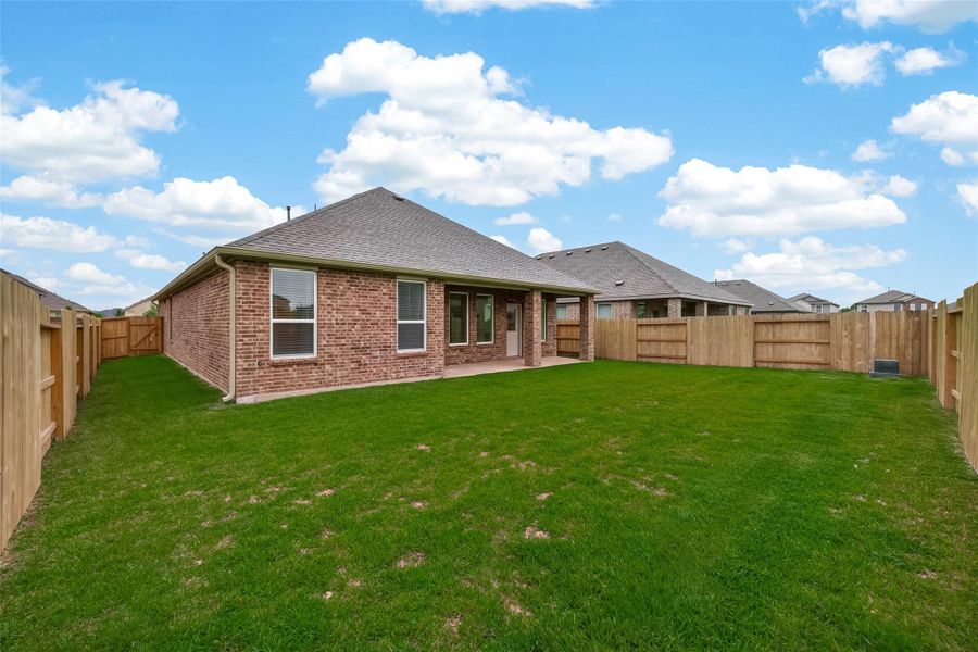 Exterior details and patio area of a home in Sunterra, Katy (Image 4).
