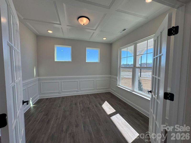 Office with wainscoting & faux coffered ceiling