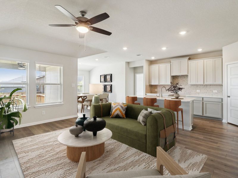 Virtually staged living and kitchen in the Callaghan floorplan at a Meritage Homes community.