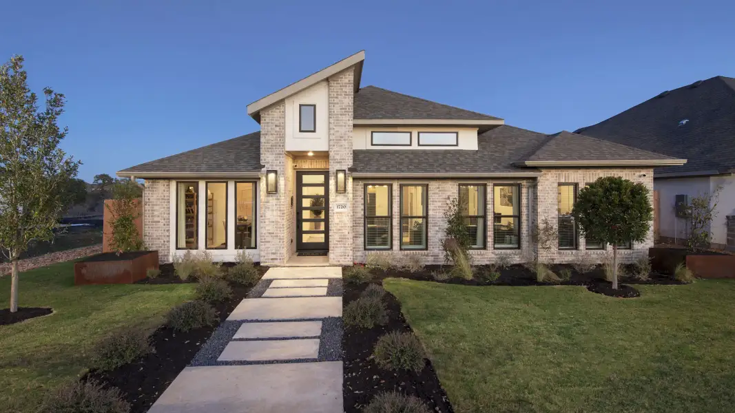 Front exterior of a new home in Mayfair, New Braunfels, TX, highlighting curb appeal (Image 20). Front exterior of a new home in Mayfair, New Braunfels, TX, highlighting curb appeal (Image 20).