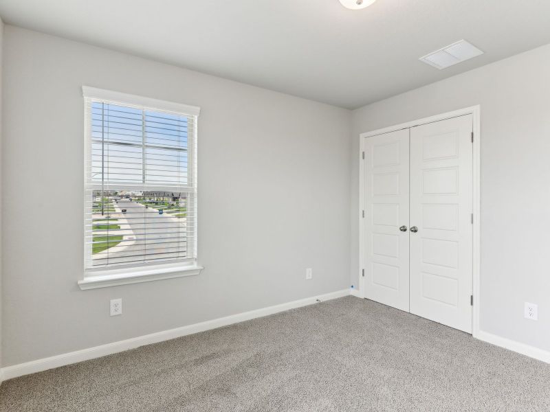 Guest bedroom in the Matador floorplan at a Meritage Homes community.