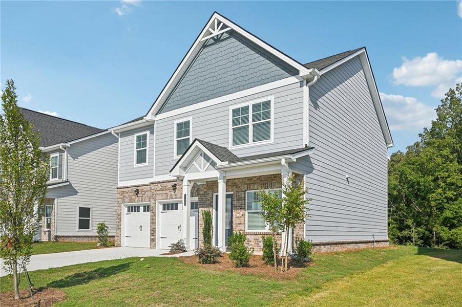 Front exterior of a new home in Neely Farm, Covington, GA, highlighting curb appeal (Image 21).