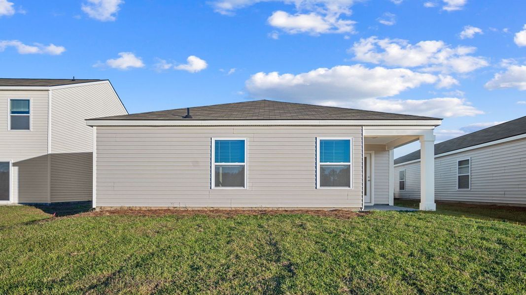 Exterior details and patio area of a home in The Groves at Bees Creek, Ridgeland (Image 4).