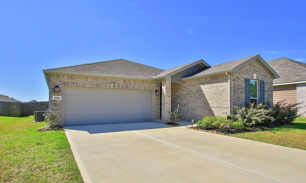 Front exterior of a new home in , Magnolia, TX, highlighting curb appeal (Image 21).