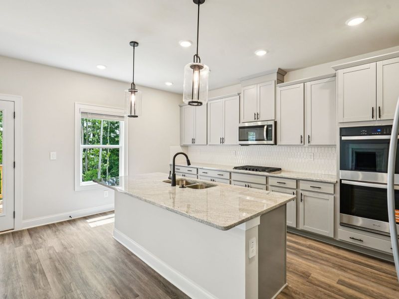 Furnished interior view inside a new home in Martin Springs - Estate Series, Lawrenceville (Image 4).
