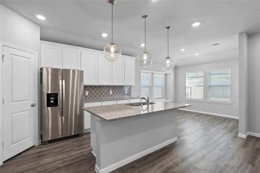 This gorgeous kitchen is an entertainer’s dream, featuring an oversized island, premium finishes, and abundant storage. Designed as the home's ultimate social hub, it offers the perfect balance of open-concept beauty and functional workspace. This gorgeous kitchen is an entertainer’s dream, featuring an oversized island, premium finishes, and abundant storage. Designed as the home's ultimate social hub, it offers the perfect balance of open-concept beauty and functional workspace.