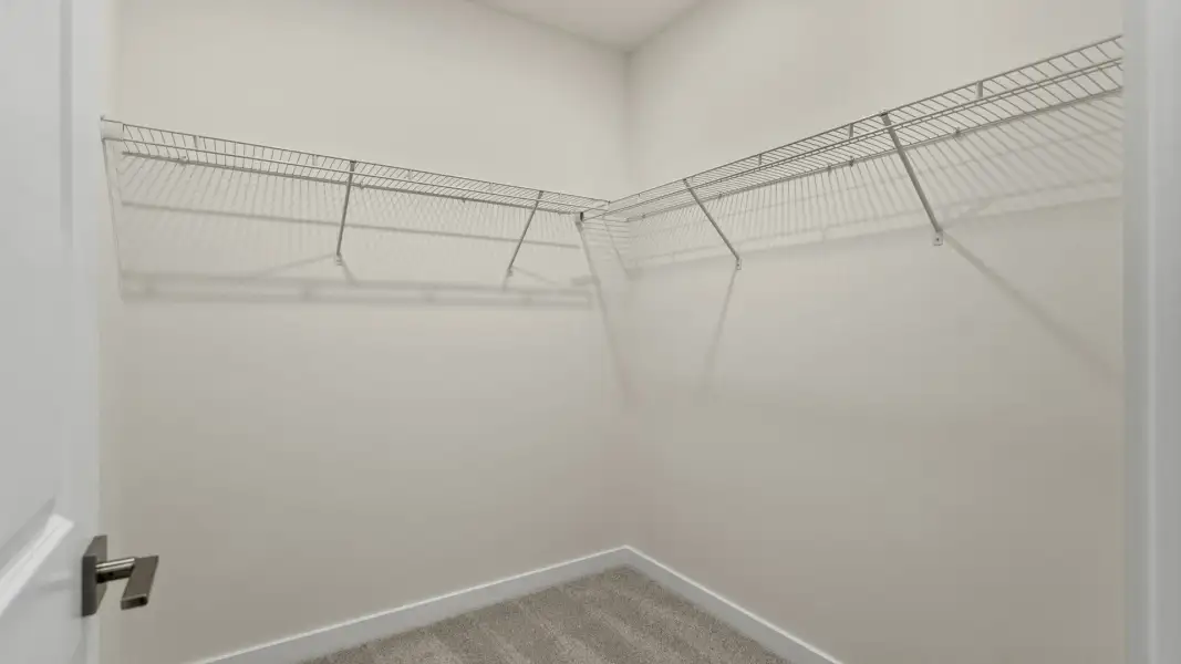 The Naples First Floor Primary walk-in closet Quick Move-In Home at Willowbrook North by DRB Homes in Winter Haven, FL