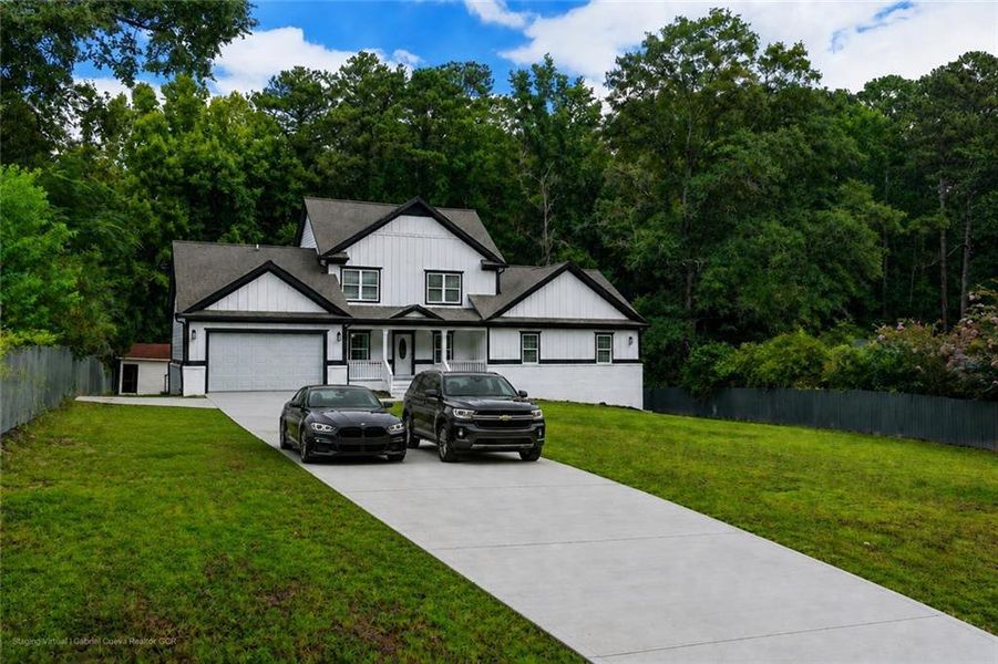 Front exterior of a new home in , Snellville, GA, highlighting curb appeal (Image 35). Front exterior of a new home in , Snellville, GA, highlighting curb appeal (Image 35).