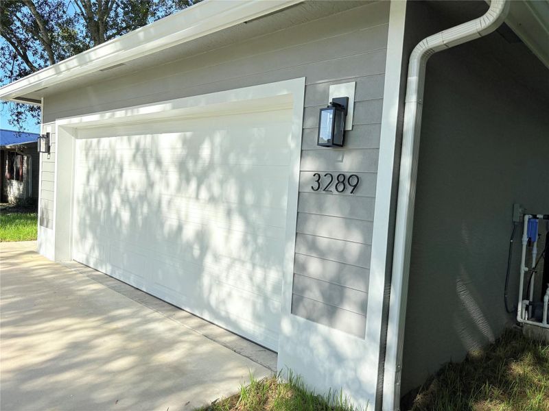 Front exterior of a new home in , Okeechobee, FL, highlighting curb appeal (Image 25).