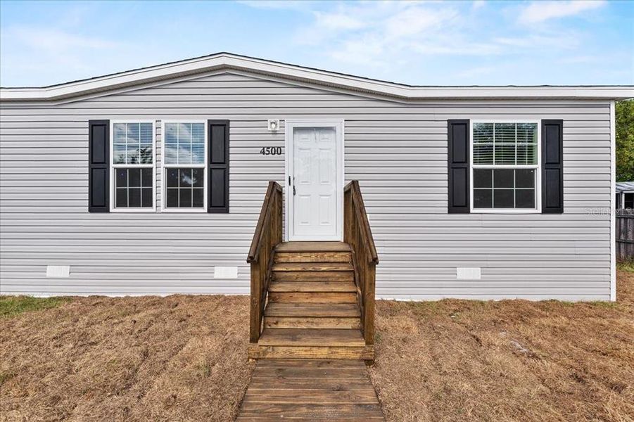 Exterior details and patio area of a home in , Holiday (Image 24).