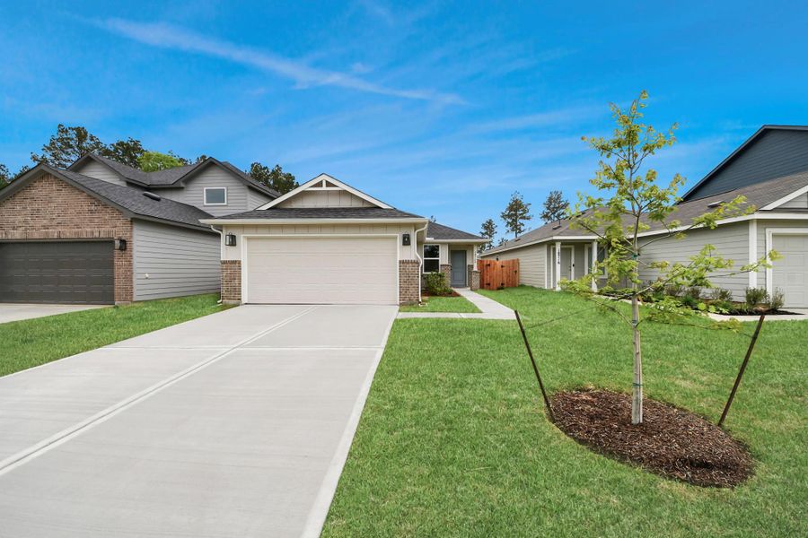 Front exterior of a new home in The Enclave at Spring Branch, Montgomery, TX, highlighting curb appeal (Image 20). Front exterior of a new home in The Enclave at Spring Branch, Montgomery, TX, highlighting curb appeal (Image 20).