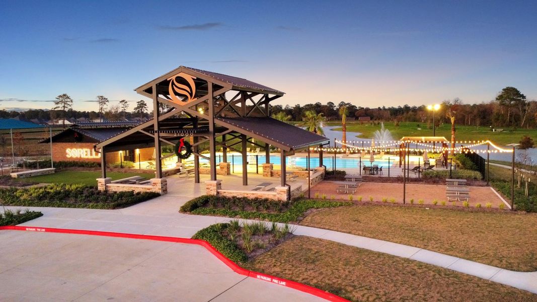 The community features serene lakeside walking trails that wind around a picturesque pond, perfect for evening strolls or morning jogs.