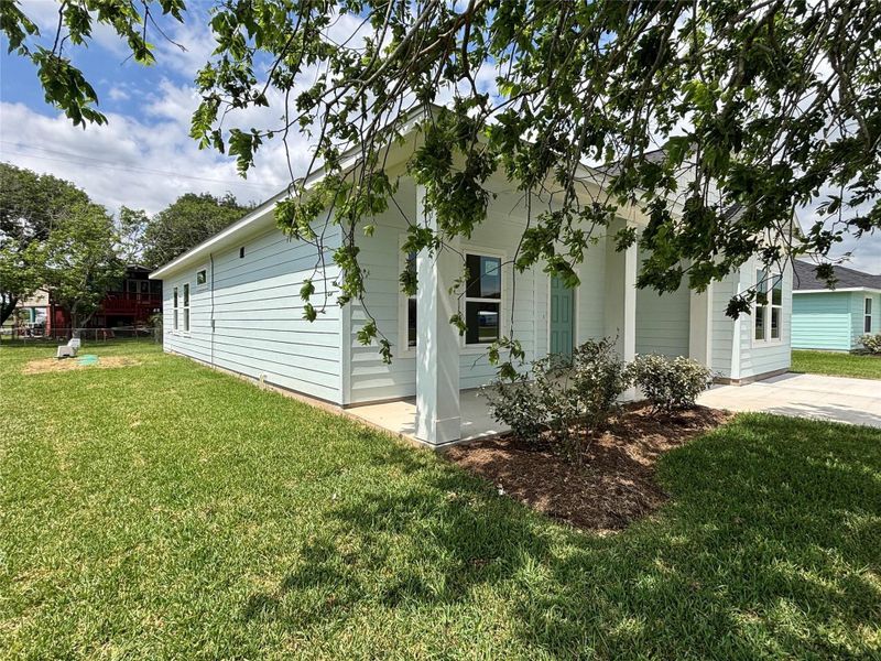 Front exterior of a new home in , Palacios, TX, highlighting curb appeal (Image 1). Front exterior of a new home in , Palacios, TX, highlighting curb appeal (Image 1).