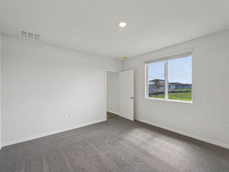 Spacious, unfurnished interior of a new home in Magnolia Bay - Premier Series, Nokomis (Image 8).