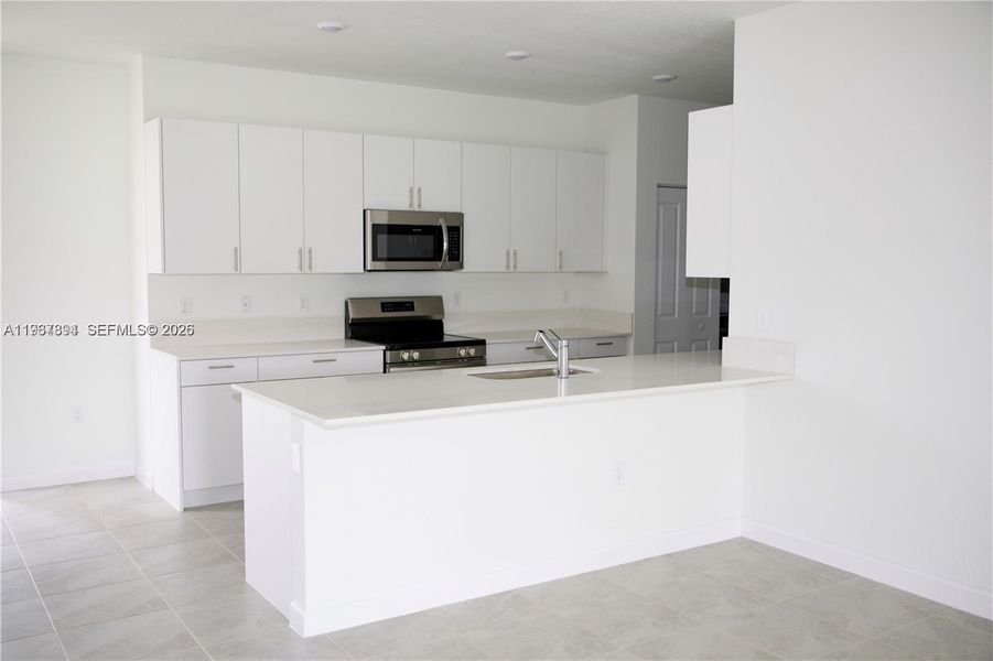 Furnished interior view inside a new home in , Dania Beach (Image 8). Furnished interior view inside a new home in , Dania Beach (Image 8).