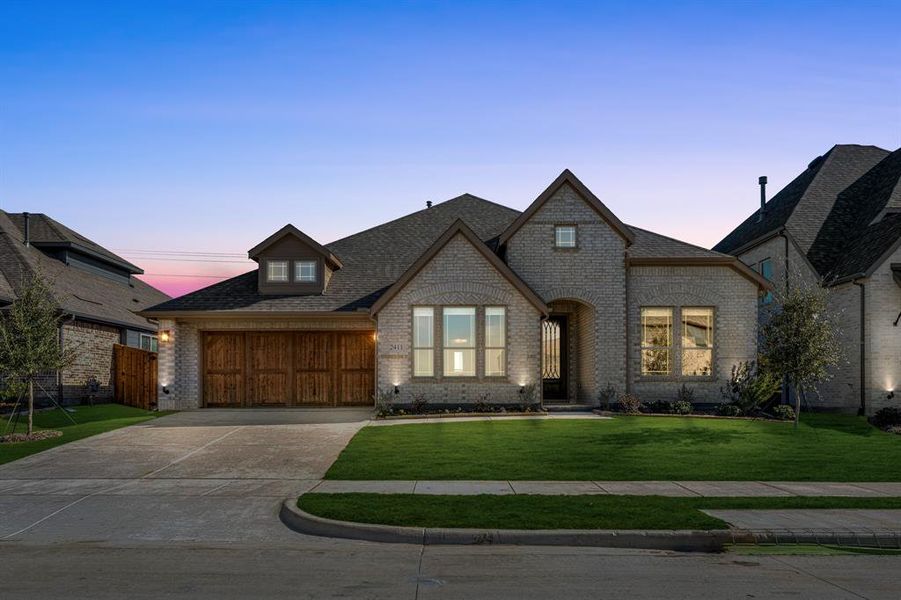 Front exterior of a new home in Sonoma Verde, McLendon-Chisholm, TX, highlighting curb appeal (Image 1).