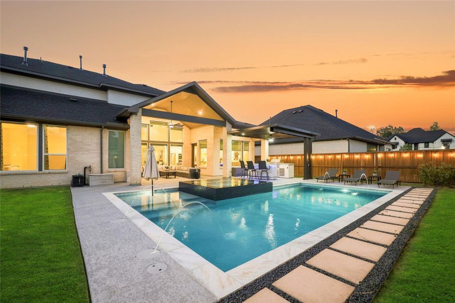 Imagine calling this home and enjoying your own private backyard oasis from sunrise to sunset and well into the evening.