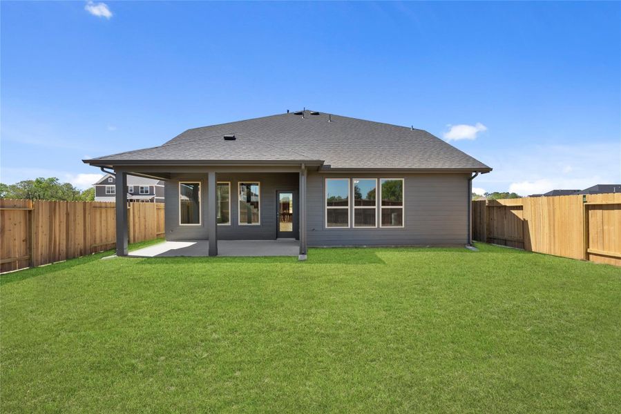 Exterior details and patio area of a home in Trinity Grove, Spring (Image 16).