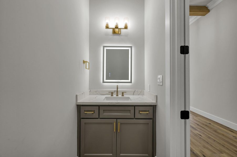The powder room off the main entry is conveniently located. The powder room off the main entry is conveniently located.