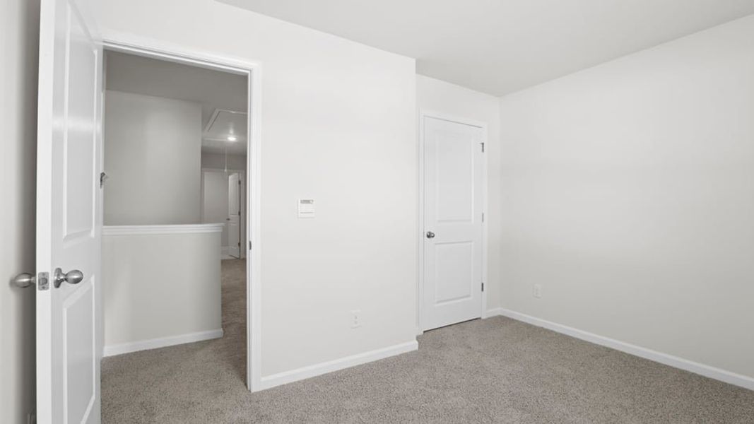 Spacious, unfurnished interior of a new home in Durbin Meadows Traditions, Fountain Inn (Image 30).