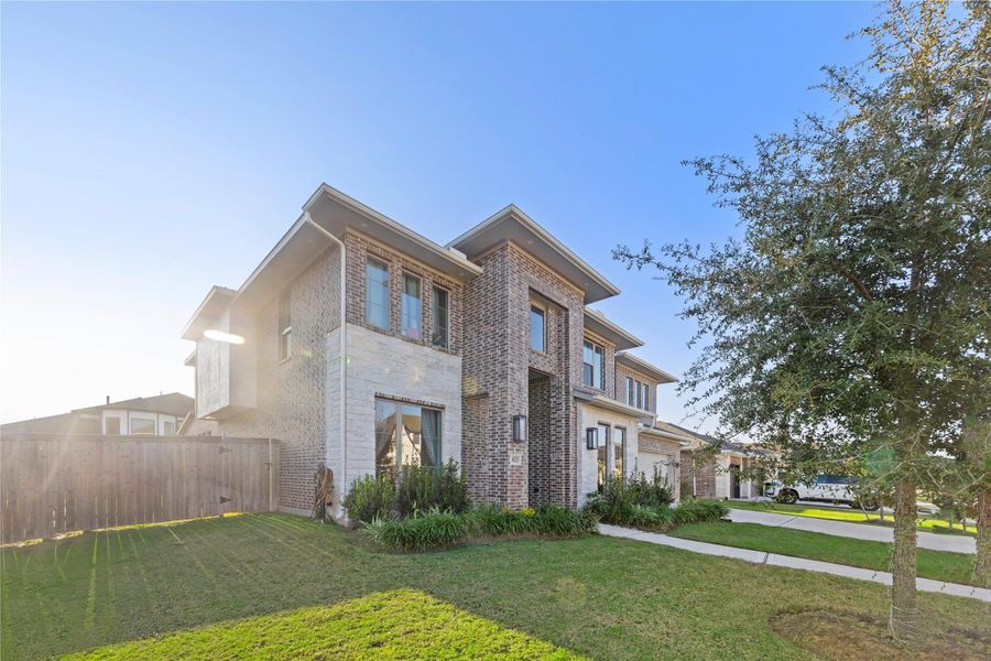Front exterior of a new home in Fulbrook On Fulshear Creek 60', Fulshear, TX, highlighting curb appeal (Image 22). Front exterior of a new home in Fulbrook On Fulshear Creek 60', Fulshear, TX, highlighting curb appeal (Image 22).