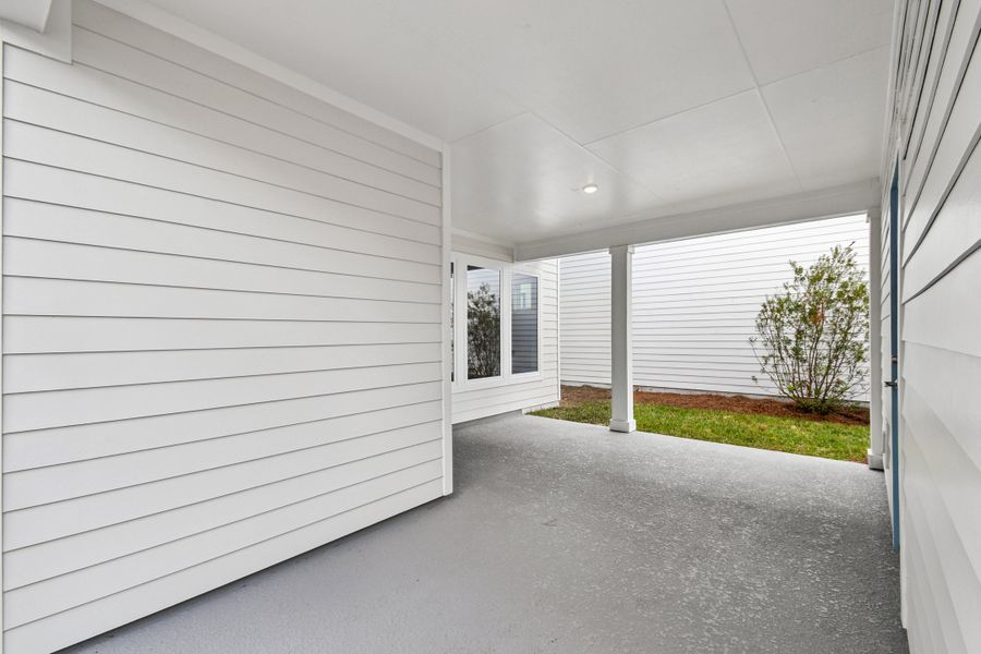 Exterior details and patio area of a home in Weslyn Park in Sunbridge 34', St. Cloud (Image 3).