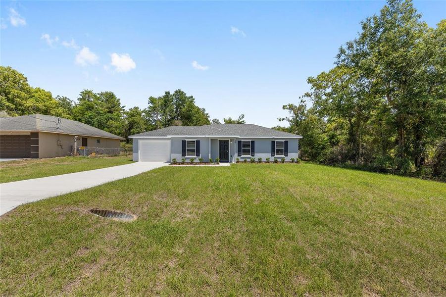 Front exterior of a new home in , Ocala, FL, highlighting curb appeal (Image 2).