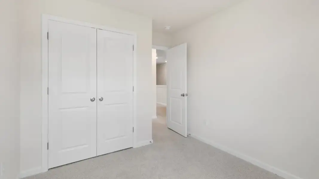 Spacious, unfurnished interior of a new home in The Townes at Galvins Ridge, Sanford (Image 20).