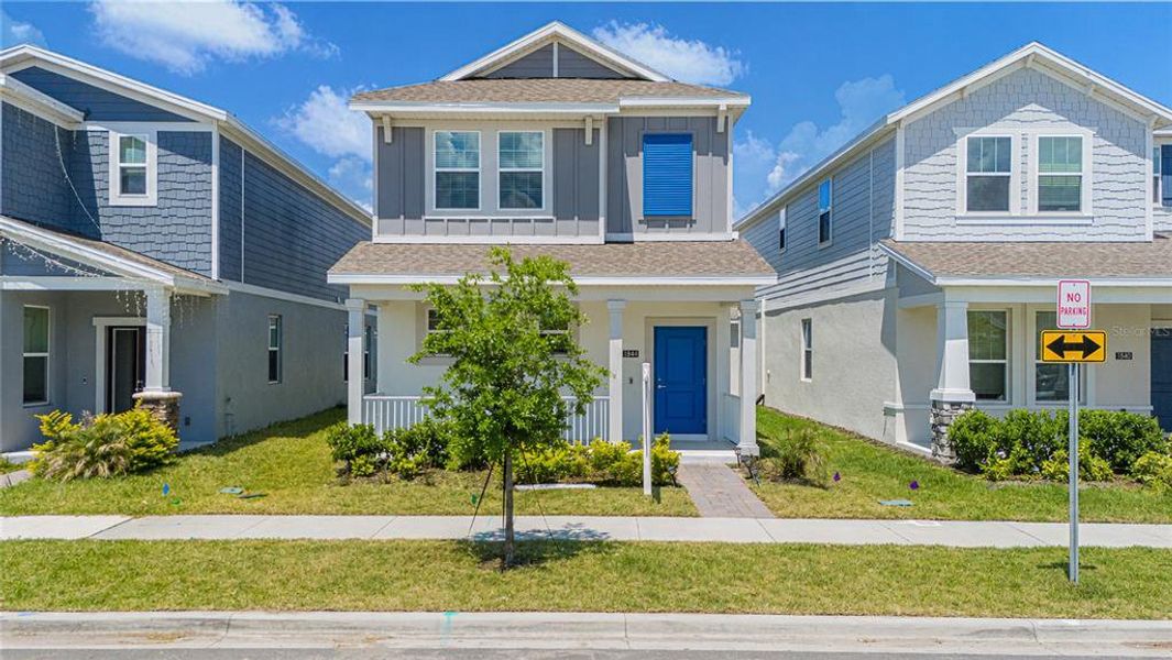 Front exterior of a new home in Tohoqua, Kissimmee, FL, highlighting curb appeal (Image 2).