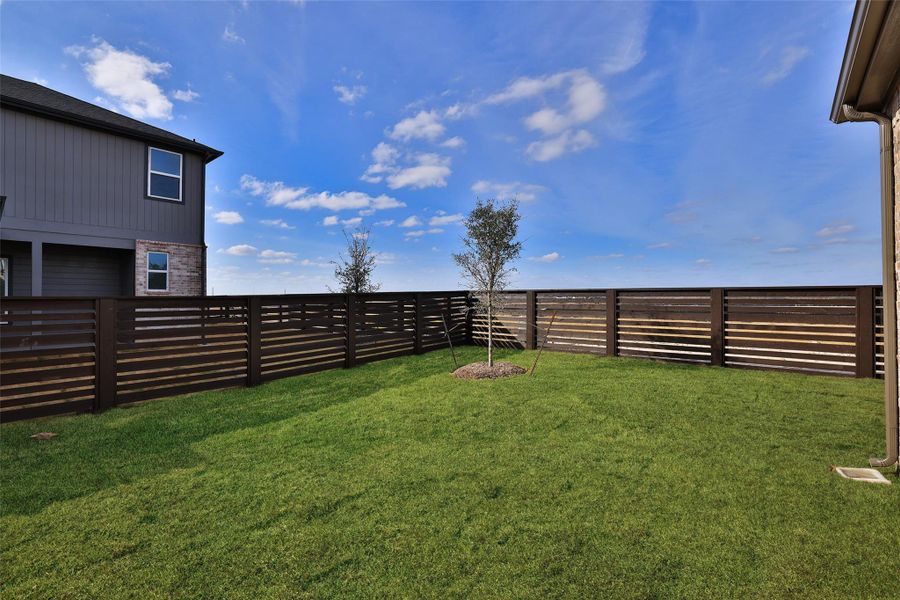 Exterior details and patio area of a home in Bridgeland Central, Cypress (Image 26).