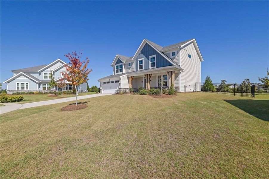 Front exterior of a new home in Sweetbay Farm, Lawrenceville, GA, highlighting curb appeal (Image 23).