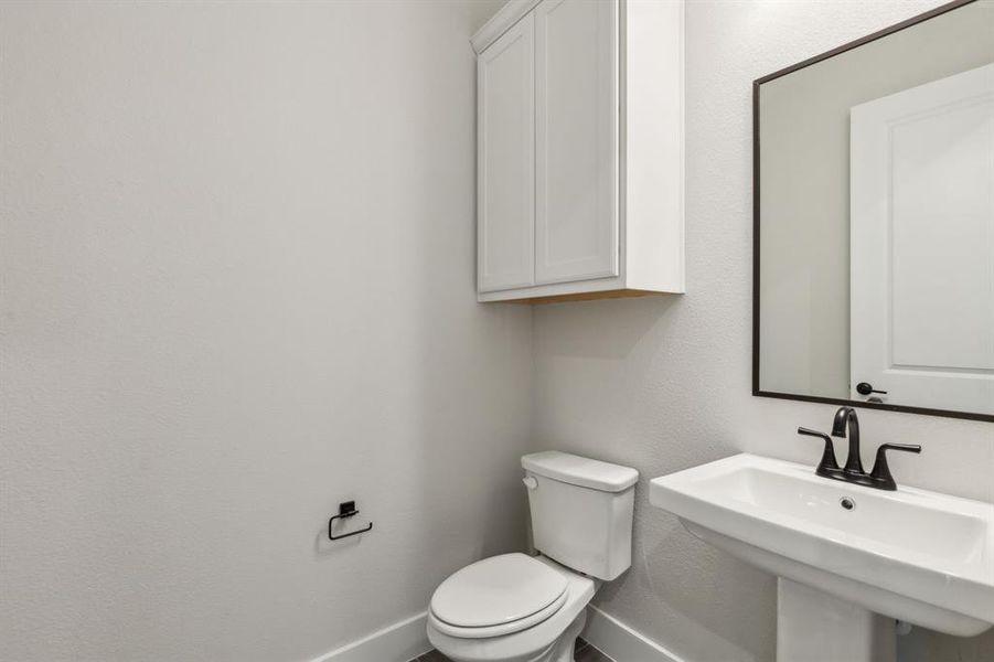 Bathroom with sink and toilet