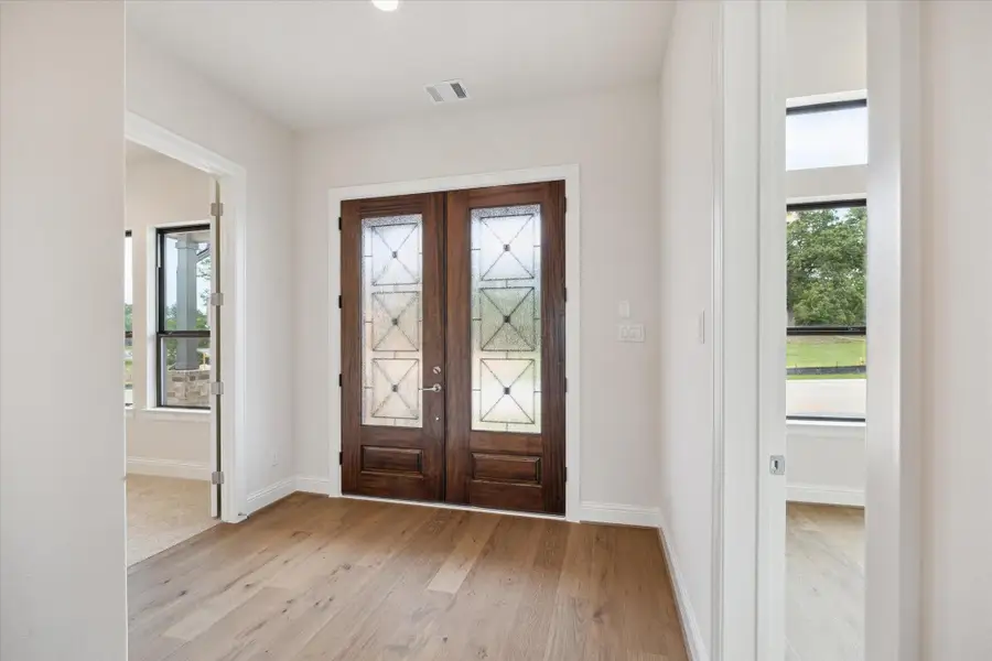 Foyer. Home Office/Study and 1 of 3 Secondary Bedrooms found off Foyer Foyer. Home Office/Study and 1 of 3 Secondary Bedrooms found off Foyer
