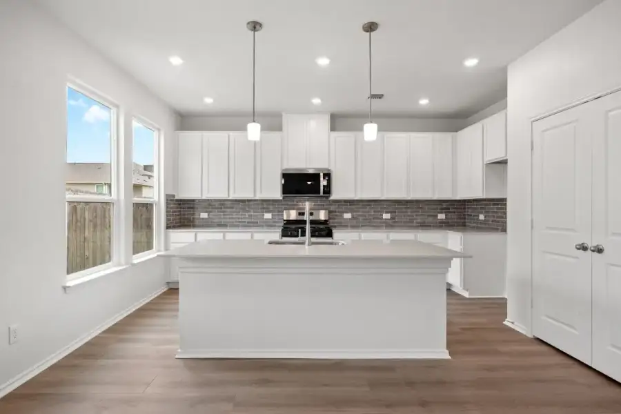 Furnished interior view inside a new home in River Bluff, Leander (Image 6).