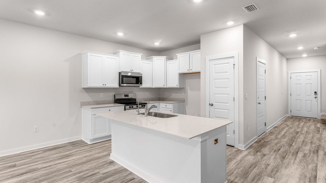 Representative furnished interior of a home built from the Palm Interior by D.R. Horton in Genoa Landing Townhomes, Freeport (Image 9).
