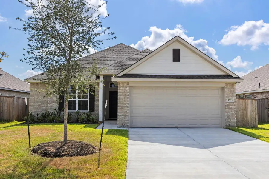 Front exterior of a new home in Ladera Creek, Conroe, TX, highlighting curb appeal (Image 1).