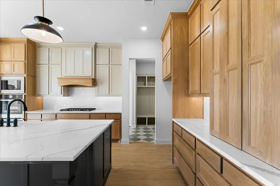 Representative furnished interior of a home built from the The Aylin by Doug Parr Custom Homes in Kessler Farms, Brock (Image 15).