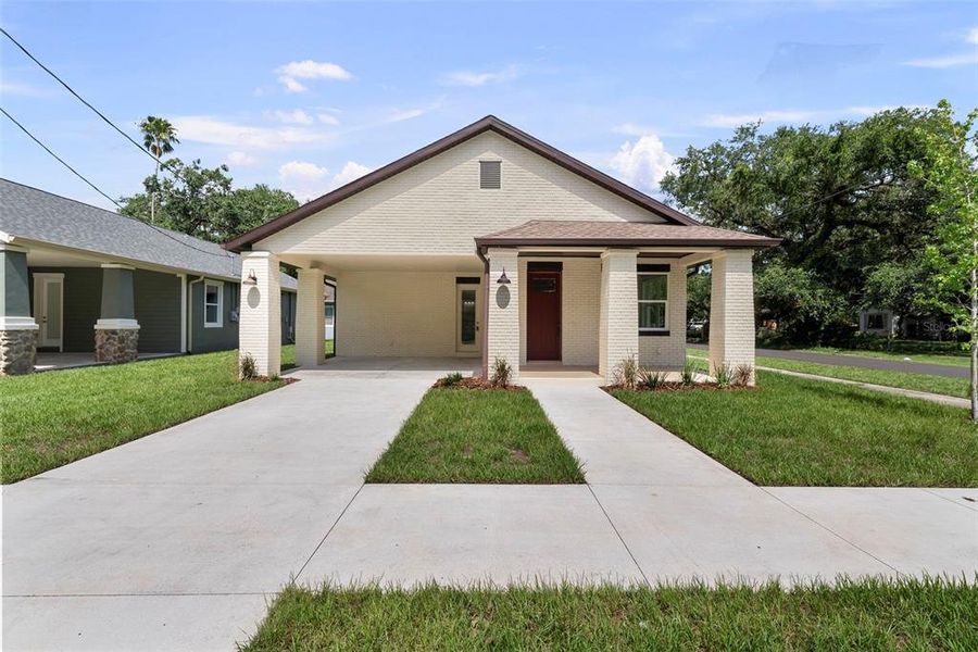 Front exterior of a new home in , Tampa, FL, highlighting curb appeal (Image 17). Front exterior of a new home in , Tampa, FL, highlighting curb appeal (Image 17).