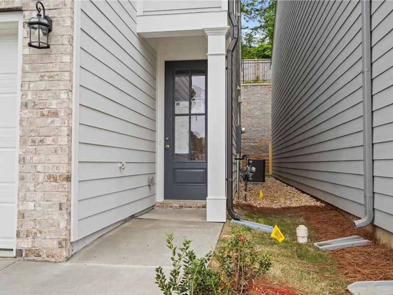 Exterior details and patio area of a home in The Village at Shallowford, Kennesaw (Image 1).