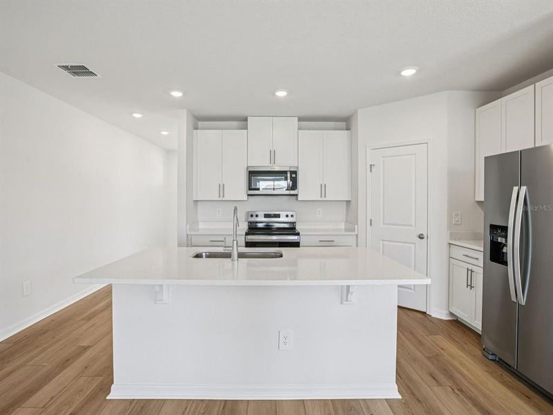 Furnished interior view inside a new home in The Grove at Stuart Crossing - Classic Series, Bartow (Image 10).