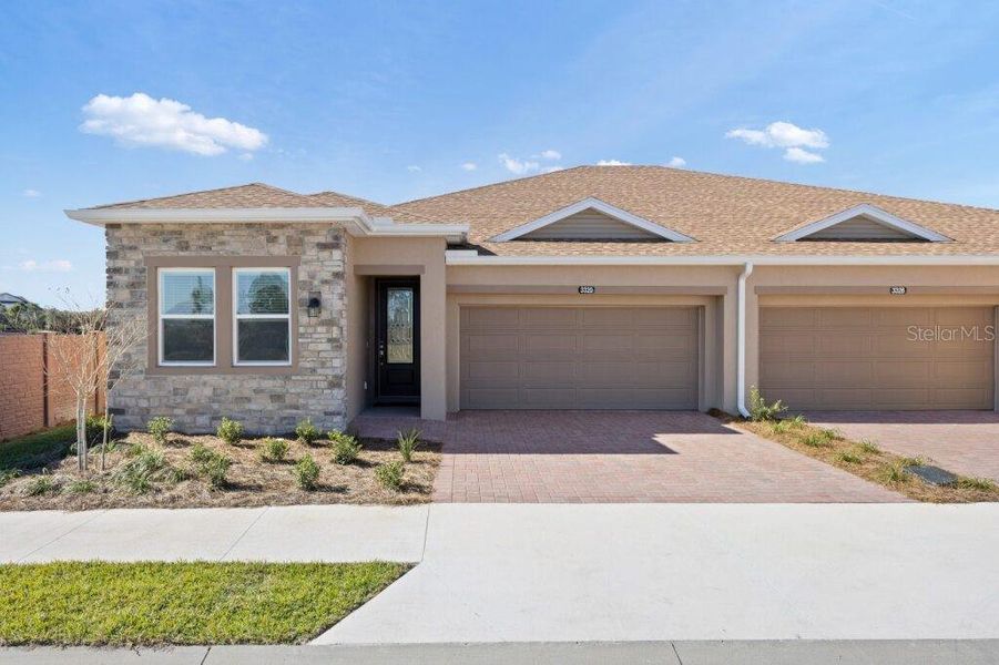 Front exterior of a new home in Ocala Preserve, Ocala, FL, highlighting curb appeal (Image 1).